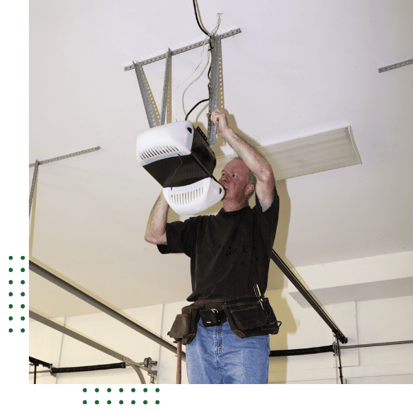 garage door technician working on repairs