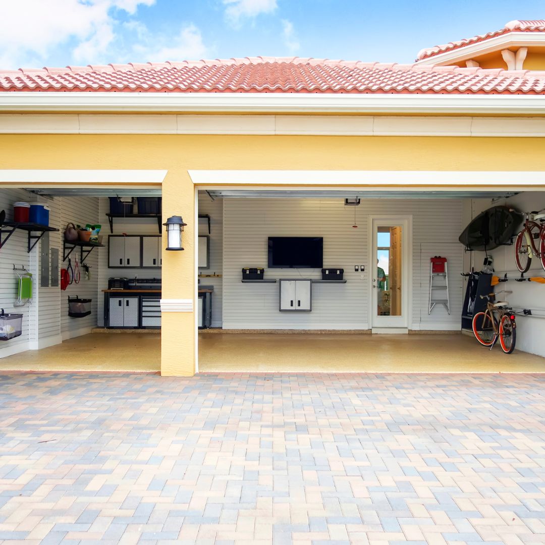 an open garage with a tv and other storage
