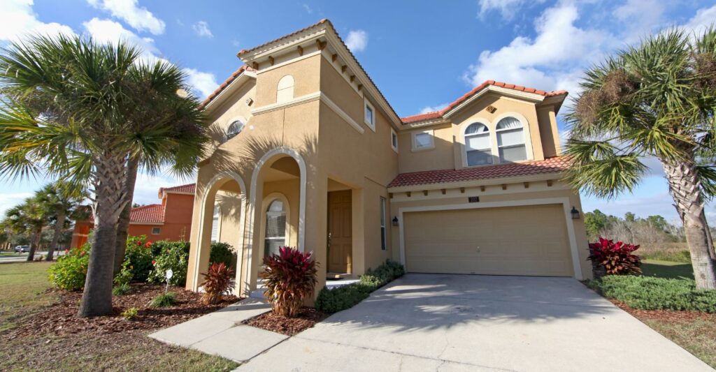 a large home with palm trees